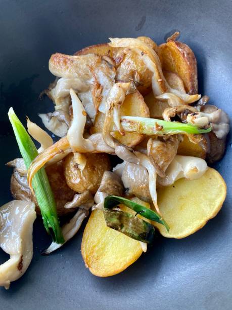 istock Fried mushrooms with potatoes 1409152731