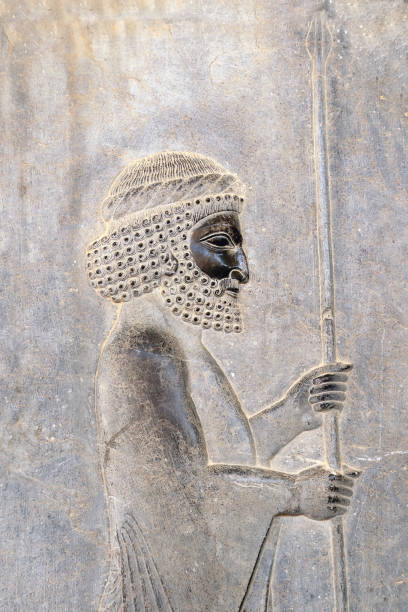 istock Ancient wall with bas-relief with assyrian warrior with with spear, Persepolis, Iran 1409152795