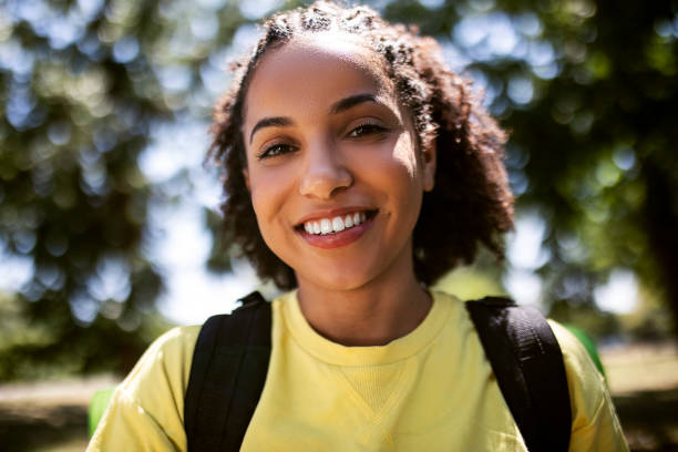 istock Young woman hiking in nature looking at camera 1409153579