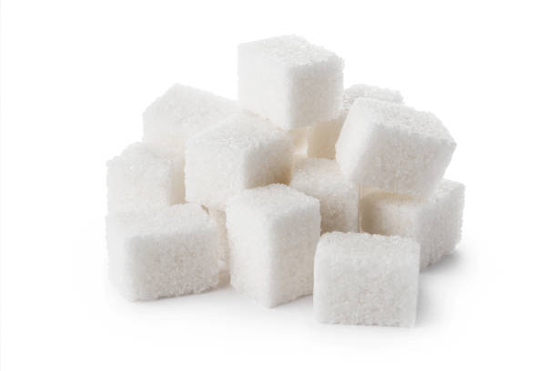istock Delicious white sugar cubes on white 1409154086