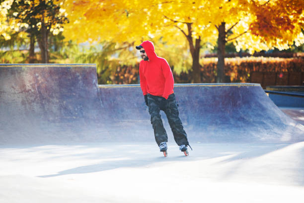 istock Middle age man roller skating in skateboard park 1409168252