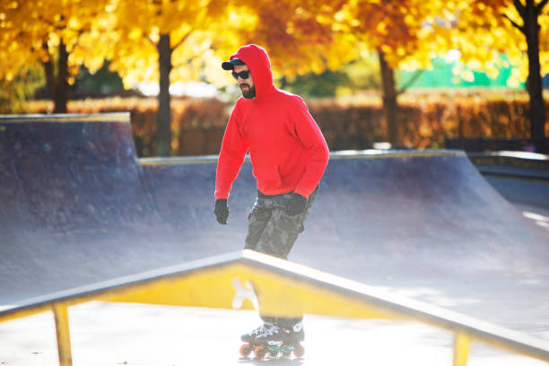 istock Middle age man roller skating in skateboard park 1409169152