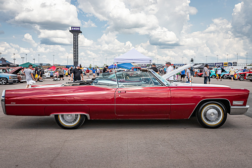 Lebanon, TN - May 14, 2022: Low perspective side view of a 1967 Cadillac de Ville Convertible at a local car show.