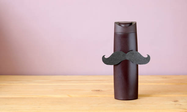 istock men's shampoo or shower gel with a paper mustache 1409169427