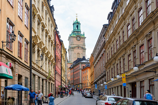 Stockholm, Sweden - June 2019: St. Nicholas church tower and narrow streets of old town (Gamla Stan)