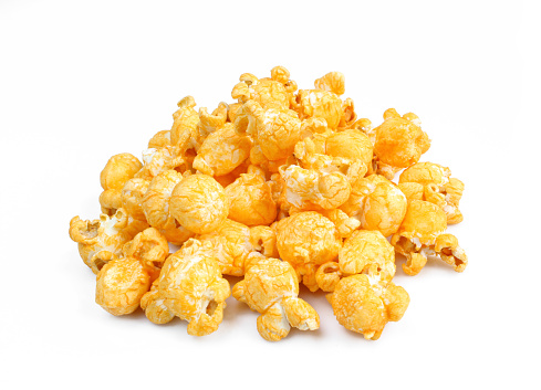 Pile of cheesy popcorns isolated on white background