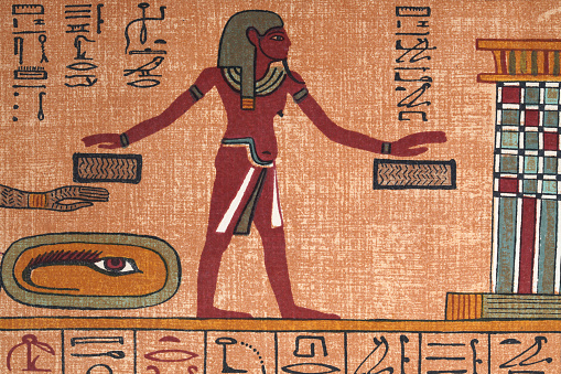 Vintage illustration detail from the Papyrus of Ani a papyrus manuscript in the form of a scroll with cursive hieroglyphs and color illustrations that was created c. 1250 BCE, during the Nineteenth Dynasty of the New Kingdom of Ancient Egypt.  eye of horus, man holding hands over boxes, judgement