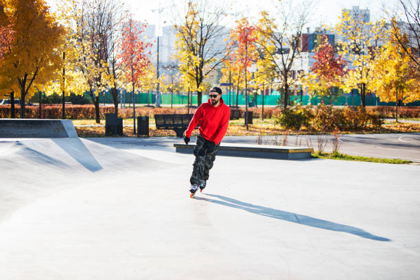 istock Middle age man roller skating in skateboard park 1409172068