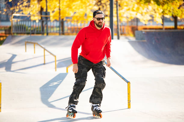 istock Middle age man roller skating in skateboard park 1409173541