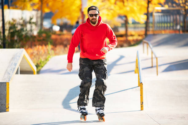 istock Middle age man roller skating in skateboard park 1409175612