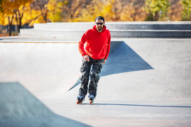 istock Middle age man roller skating in skateboard park 1409175776