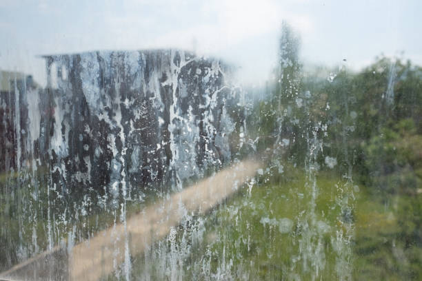 istock Dirty glass lit by the sun. Unclean window soiled with dus 1409175937
