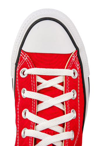 Isolated View From Above Of A Retro Red Canvas Sneaker On A White Background