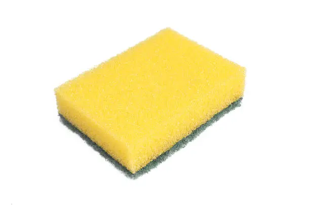 Yellow kitchen sponge isolated on white background