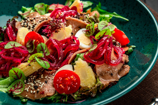 istock Beef tongue salad with fresh vegetables, pickled onions and mini corn 1409179436