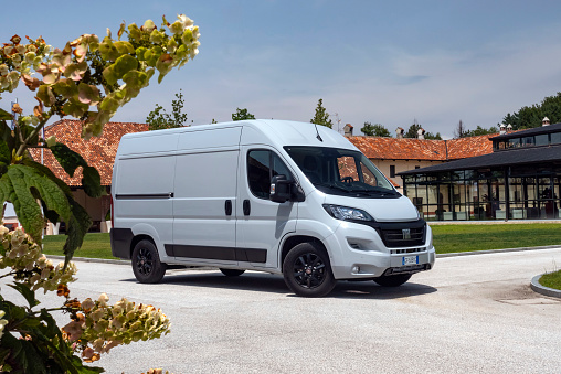 Balocco, Italy - 12 July, 2021: Fiat Ducato stopped on a street. This model is one of the most popular commercial vehicles in Europe.