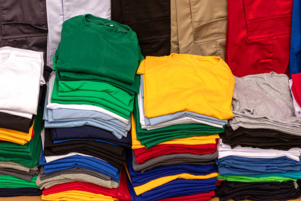 Stack of colorful cotton shirts sold on local market