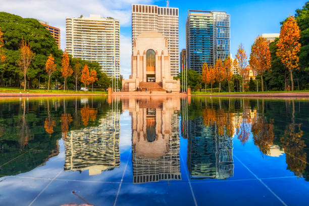 Anzac Memorial, Sydney Reflection of high-rise apartment building towers and war memorial in Hyde park of Sydney, Australia. hyde park sydney stock pictures, royalty-free photos & images