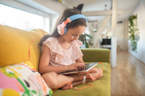 istock A little girl is having fun on a tablet 1409188734