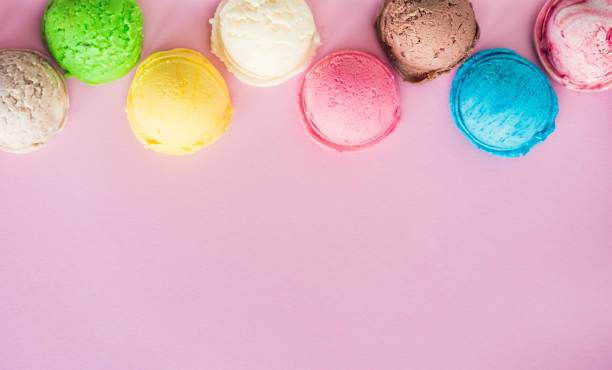 istock Colorful ice cream scoops on pink background 1409195064