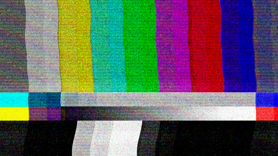 Color bars on a TV monitor with bad interference, glitch and noisy stripes.  Television signal error, flickering test screen background. Digitally generated image.