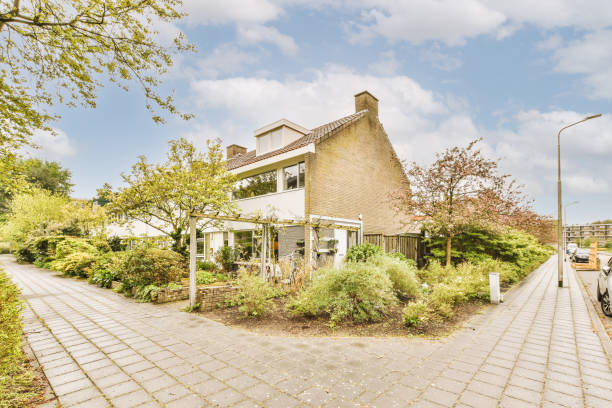 istock View of brick house from sidewalk 1409196470