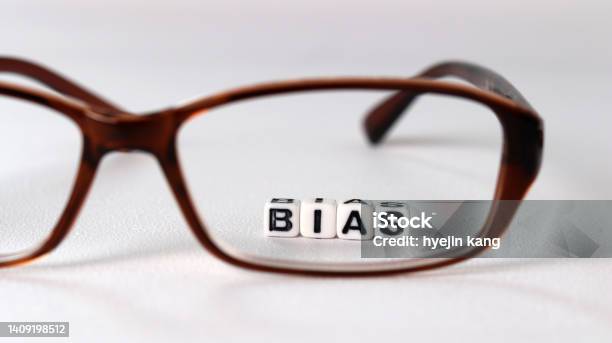 The Concept Of Biased Views Judged By Appearances Stock Photo - Download Image Now - Bias, Rebellion, Alphabet