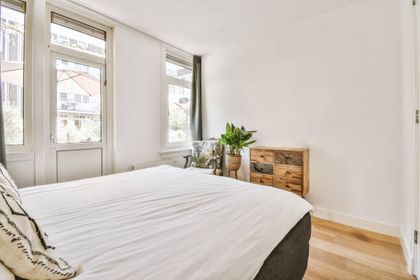 istock Light bedroom with balcony door 1409199239