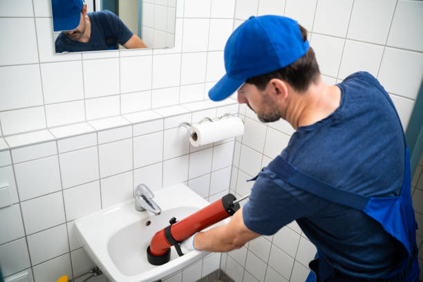istock Plumber Cleaning Drain And Bathroom Sink 1409201851