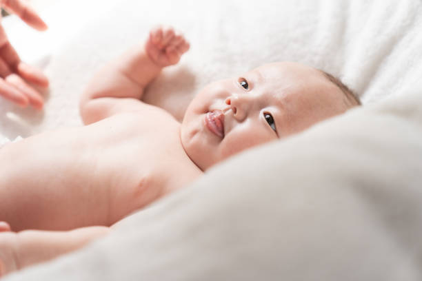 istock cute baby , mother's hand 1409202556