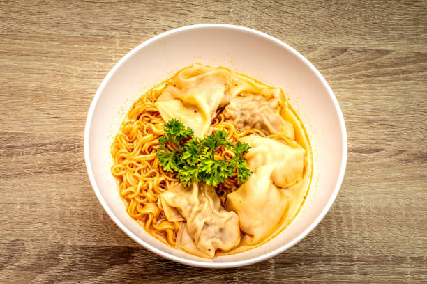 Egg noodles with pork wonton soup stock photo