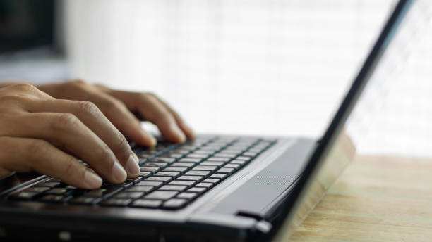 istock Closeup man hands typing on a computer keyboard, businessman or student using laptop at home, online learning, internet marketing, working from home, office workplace, freelance concept 1409210901