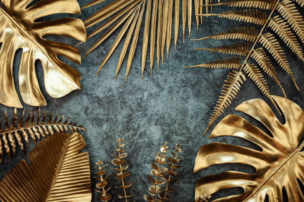 istock Creative nature gold layout made of tropical leaves. 1409213569
