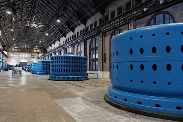 Electricity generators inside a historic hydro-electric power plant stock photo
