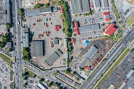 city industry landscape from drone. industrial buildings, warehouses, garage or service station. aerial photography.