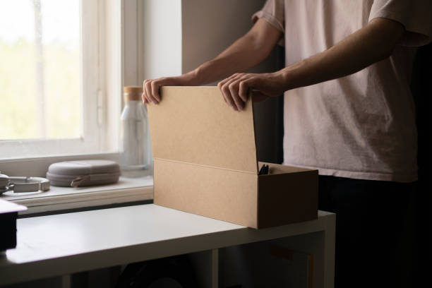 istock opening the cardboard box with new order purchase 1409218504