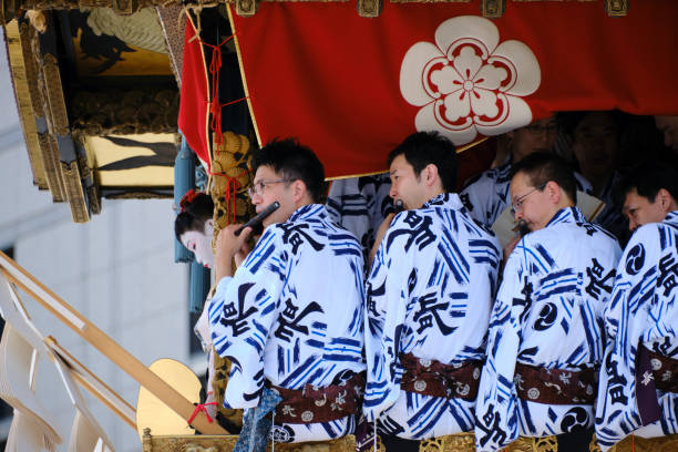 Musicians perform atop the lead float at the Gion Festival stock photo