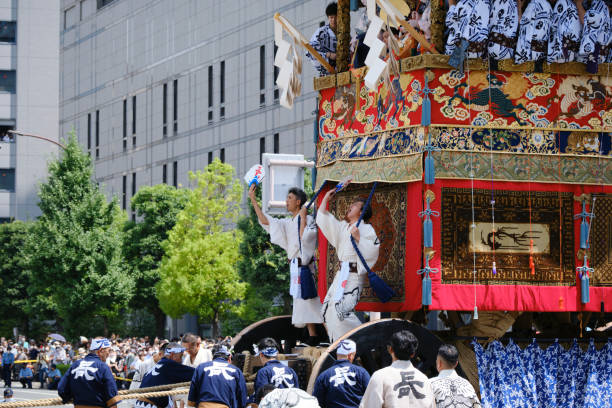 The Naginata float begins moving down Oike Street stock photo