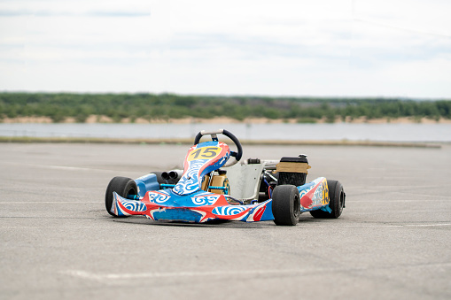 Competitive Latin American man racing in go-carts - leisure activities concepts