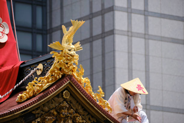 Man in conical hat on top of the lead float at the Gion Festival stock photo