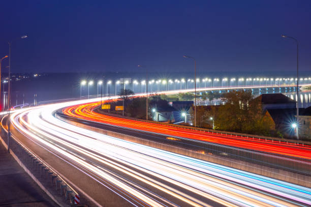 istock Evening Car Traffic With Light Trails on the Highway in Ukraine 1409223036