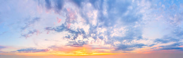 istock Majestic gentlel sunrise sundown sky background with light colorful clouds 1409226057
