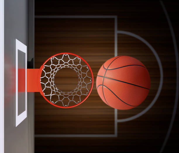 istock A player throws a basketball towards the net and trying to get a score, top view. 3d render 1409233294