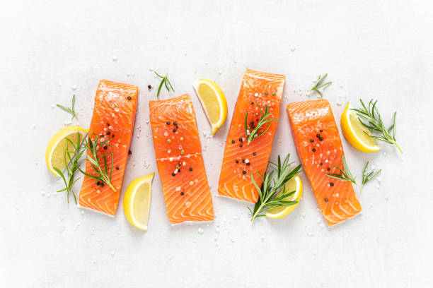 istock Salmon. Fresh raw salmon fish fillet on white background 1409236227