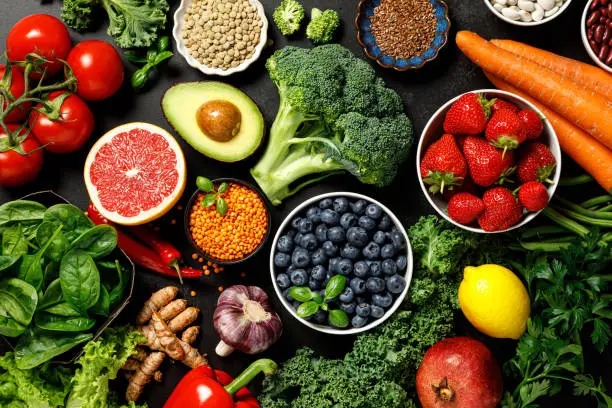 Photo of Healthy food. Healthy eating background. Fruit, vegetable, berry.  Vegetarian eating. Superfood