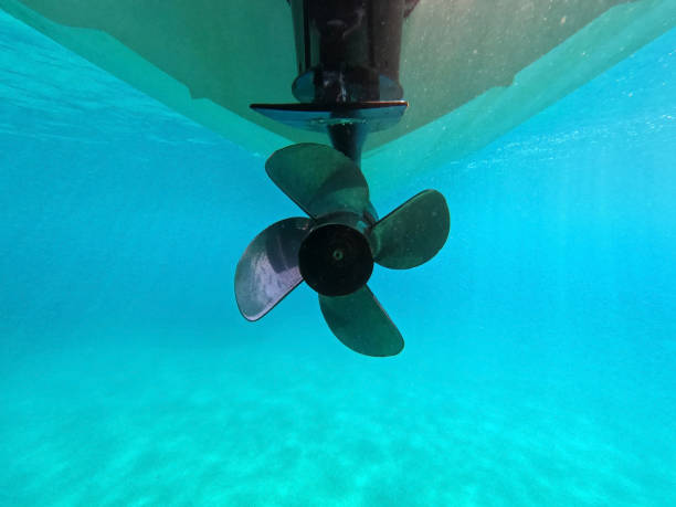 underwater shot of a propeller of a motor boat in the sea underwater shot of a propeller of a motor boat in the sea. thrust stock pictures, royalty-free photos & images