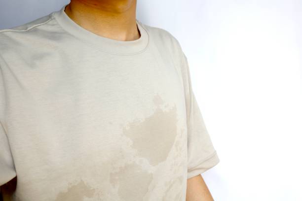 The shirt worn by the man is wet due to sweat. stock photo