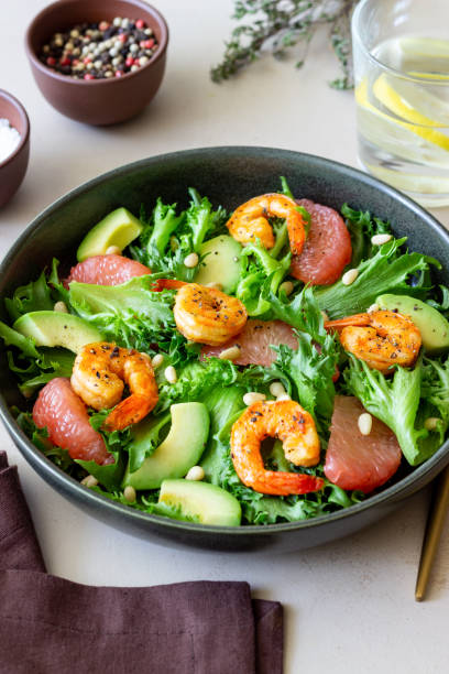istock Salad with shrimp, grapefruit, avocado and nuts. Healthy eating. Diet. 1409242293