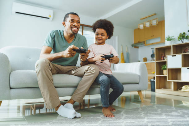 istock African Father and son playing video games 1409243041