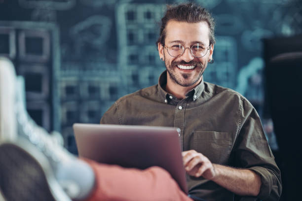 Young creative professional working comfortably in a modern office